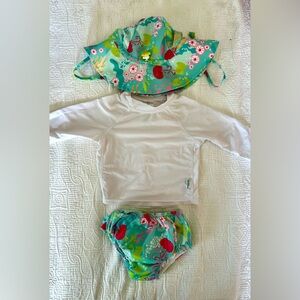 Green sprout rash guard top, swim diaper, and hat set.